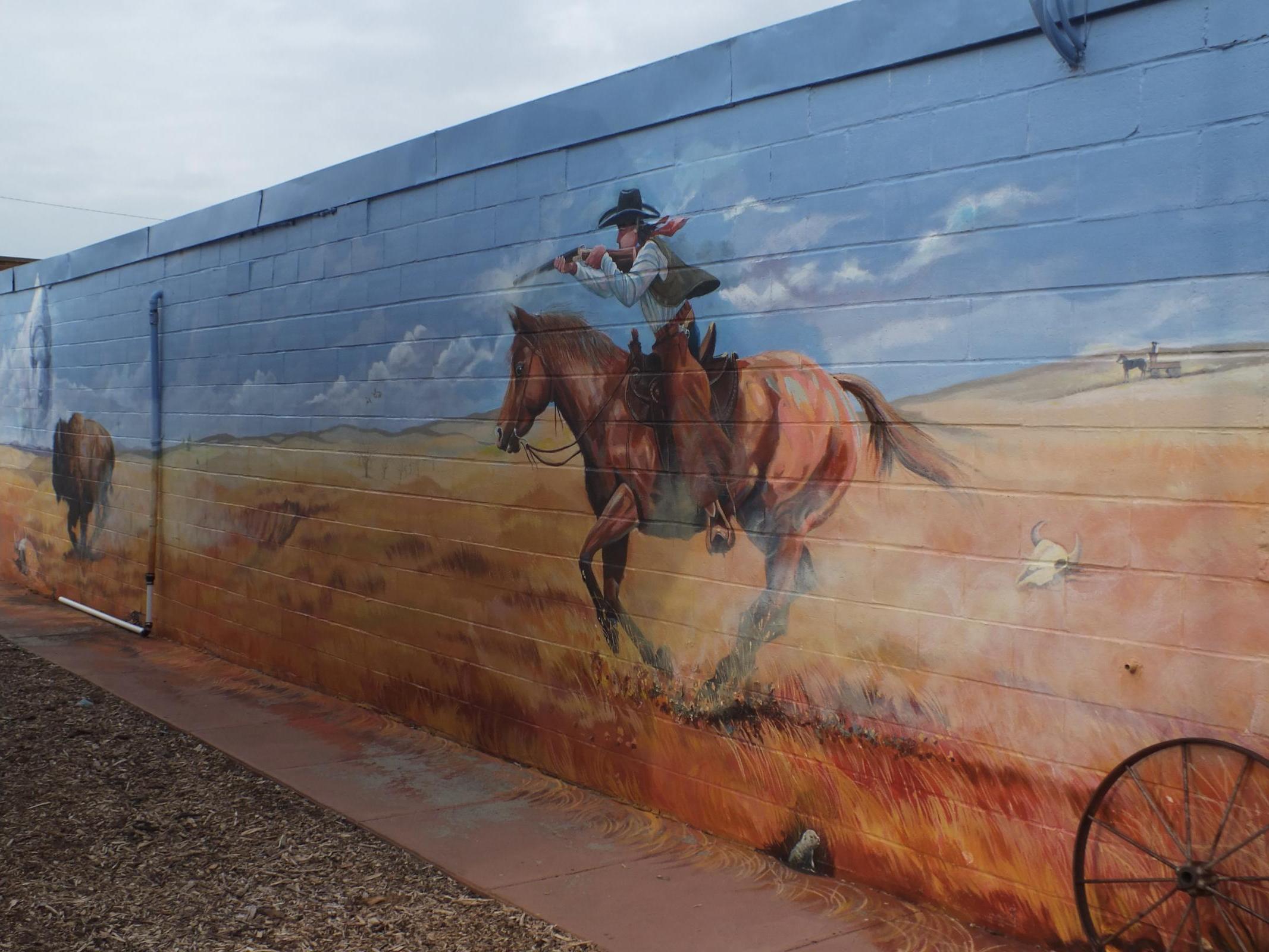 mural from behind carousel's image